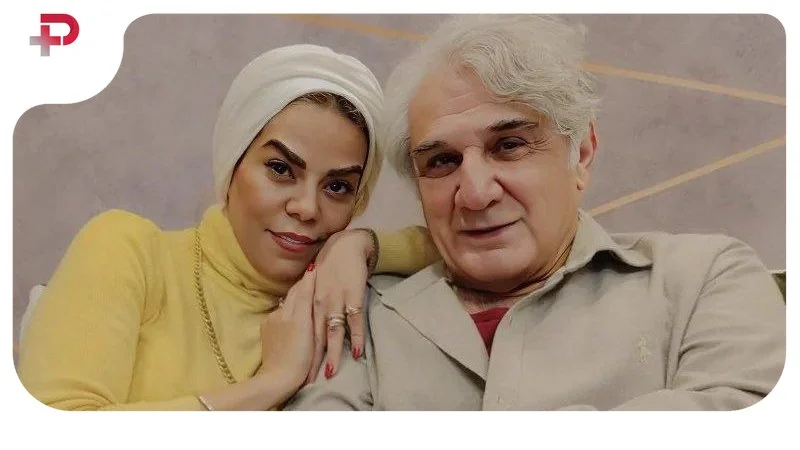 عکس| مهدی هاشمی و زن جوانش؛ همسر آقای بازیگر با پالتو قرمز جلب توجه کرد