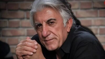 عکس| بوسه بامزه رضا کیانیان کنار همسر زیبایش در جوانی