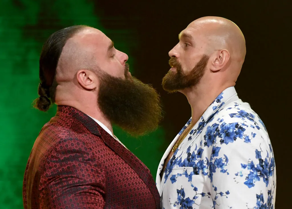 beards-armor-during-fights Two bearded men in bold jackets face off, noses inches apart, on a stage with green lighting.